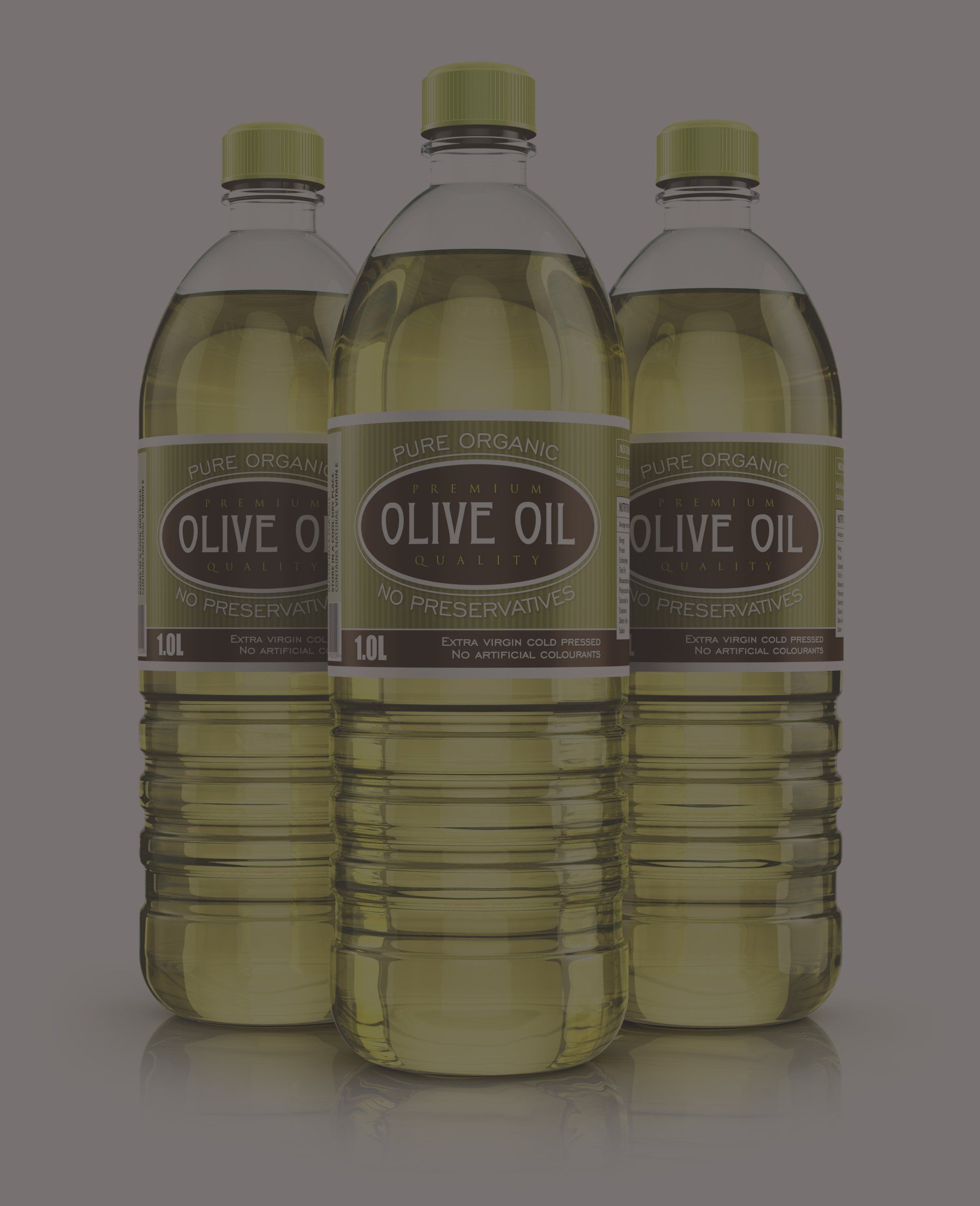 Three bottles of olive oil are sitting next to each other on a table.