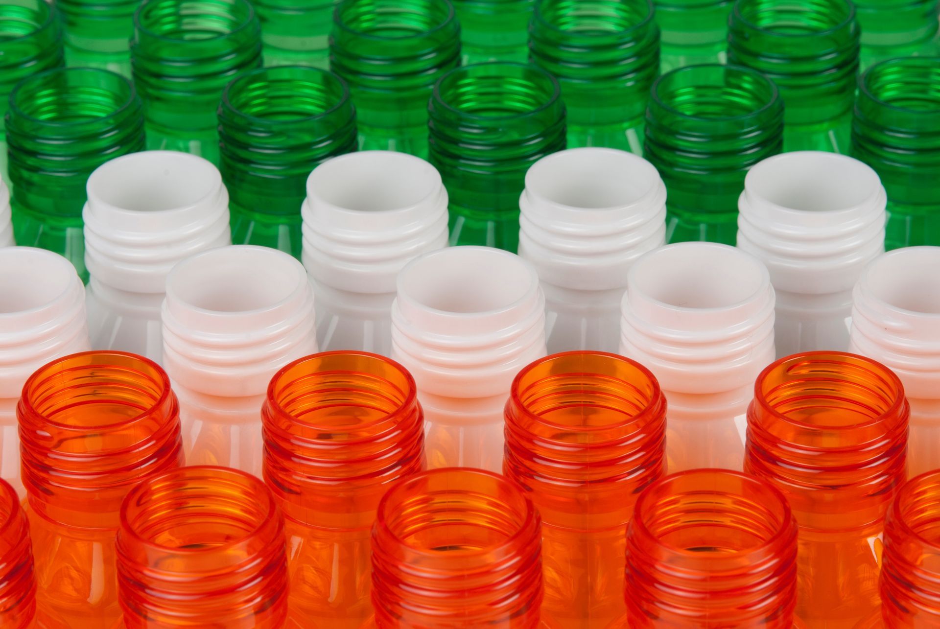 Multi-colored PET plastic pill bottles on display.
