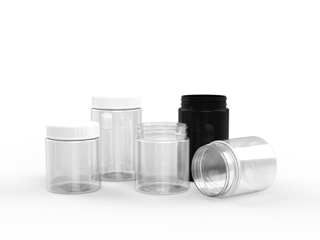 A group of clear plastic jars with white and black lids on a white background.