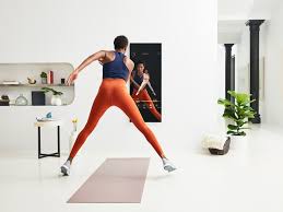 Woman working out in front of mirror.