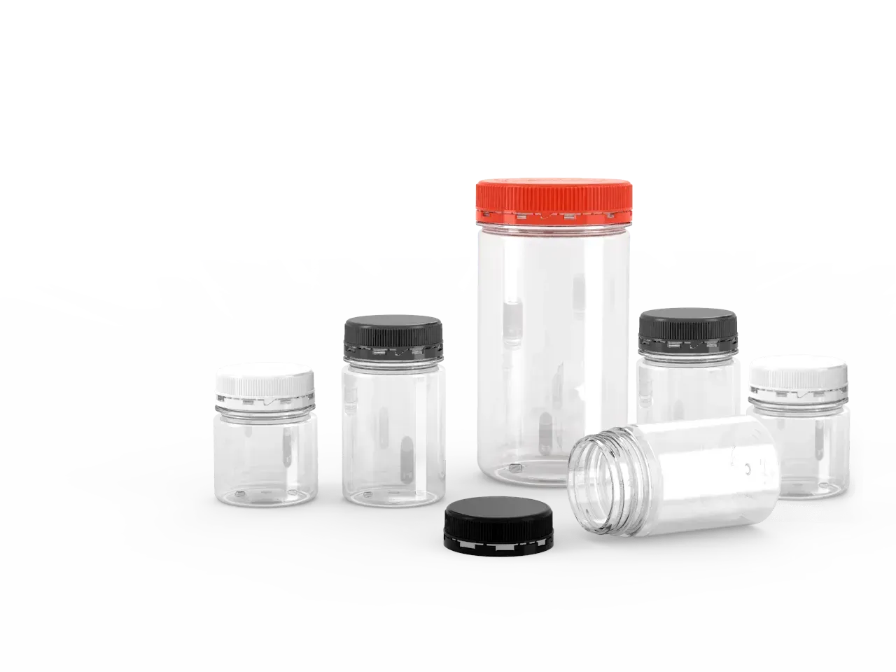 A group of clear plastic bottles with red caps on a white background.