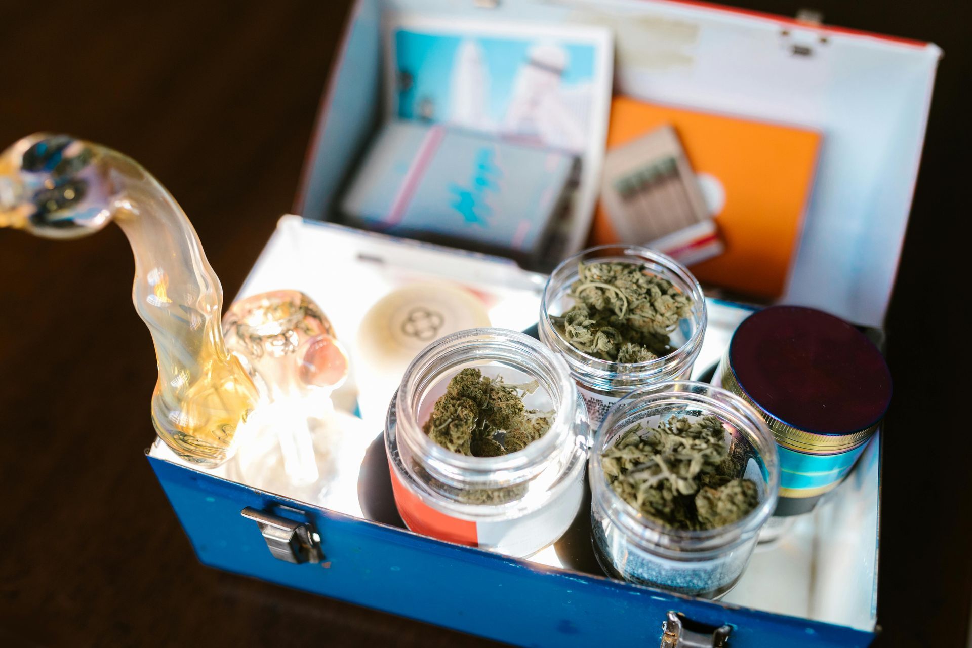 A decorative box containing cannabis products in small jars