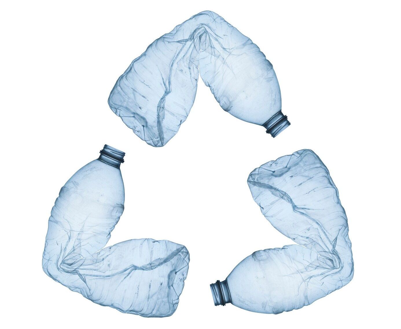 Three plastic bottles are arranged in a recycling symbol