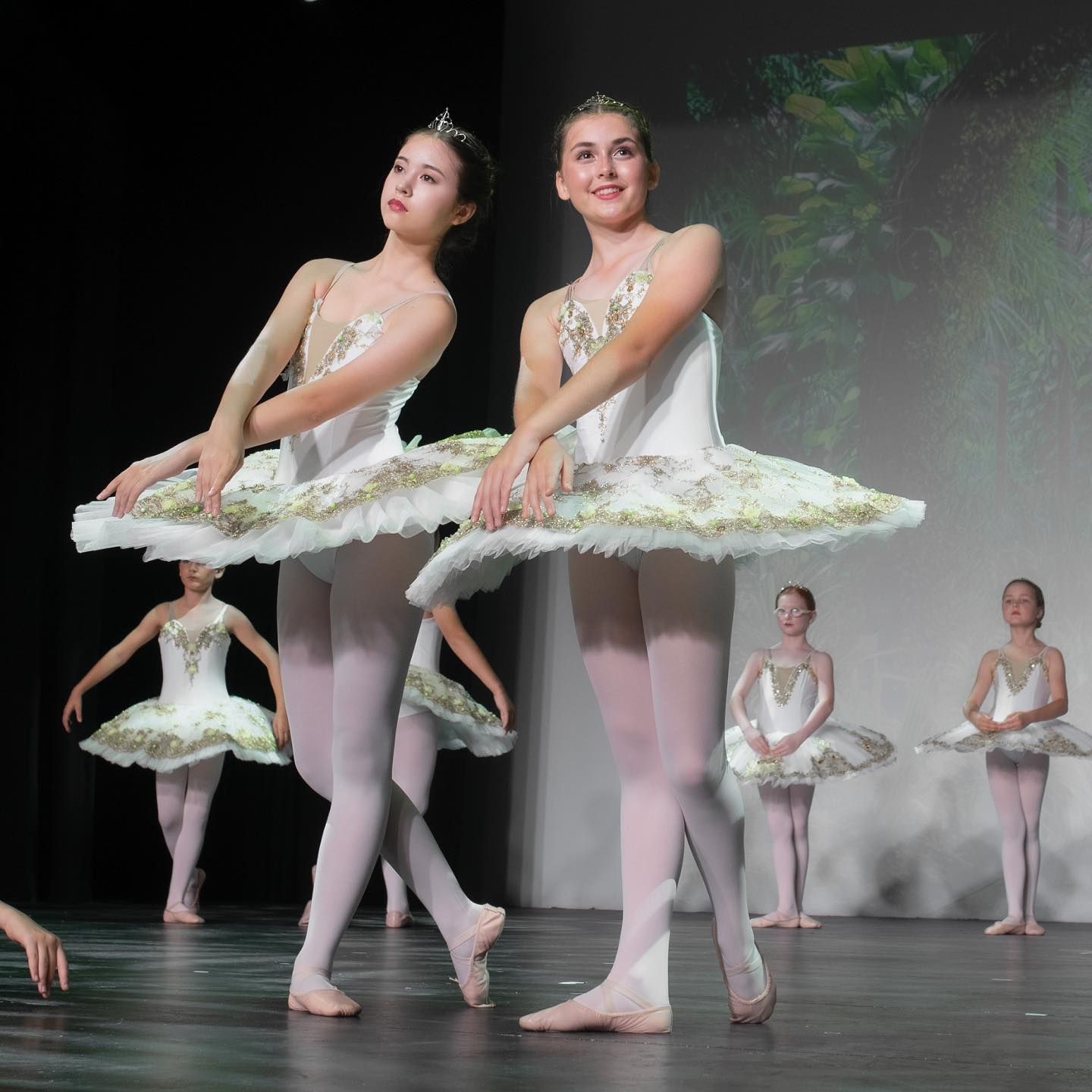Ballet Dancers in White Tutus and Tiaras Perform on Stage — Kay Flynn Dancing Academy Southport in Southport, QLD