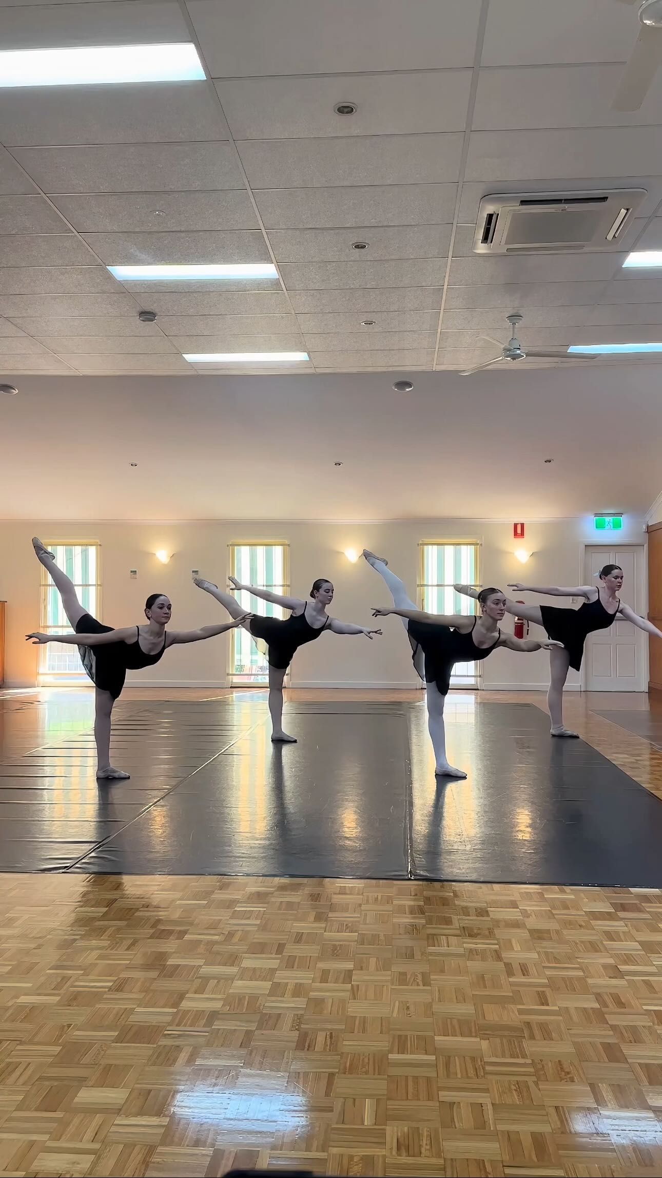 Four Ballerinas in Black Leotards and Pointe Shoes — Kay Flynn Dancing Academy Southport in Southport, QLD