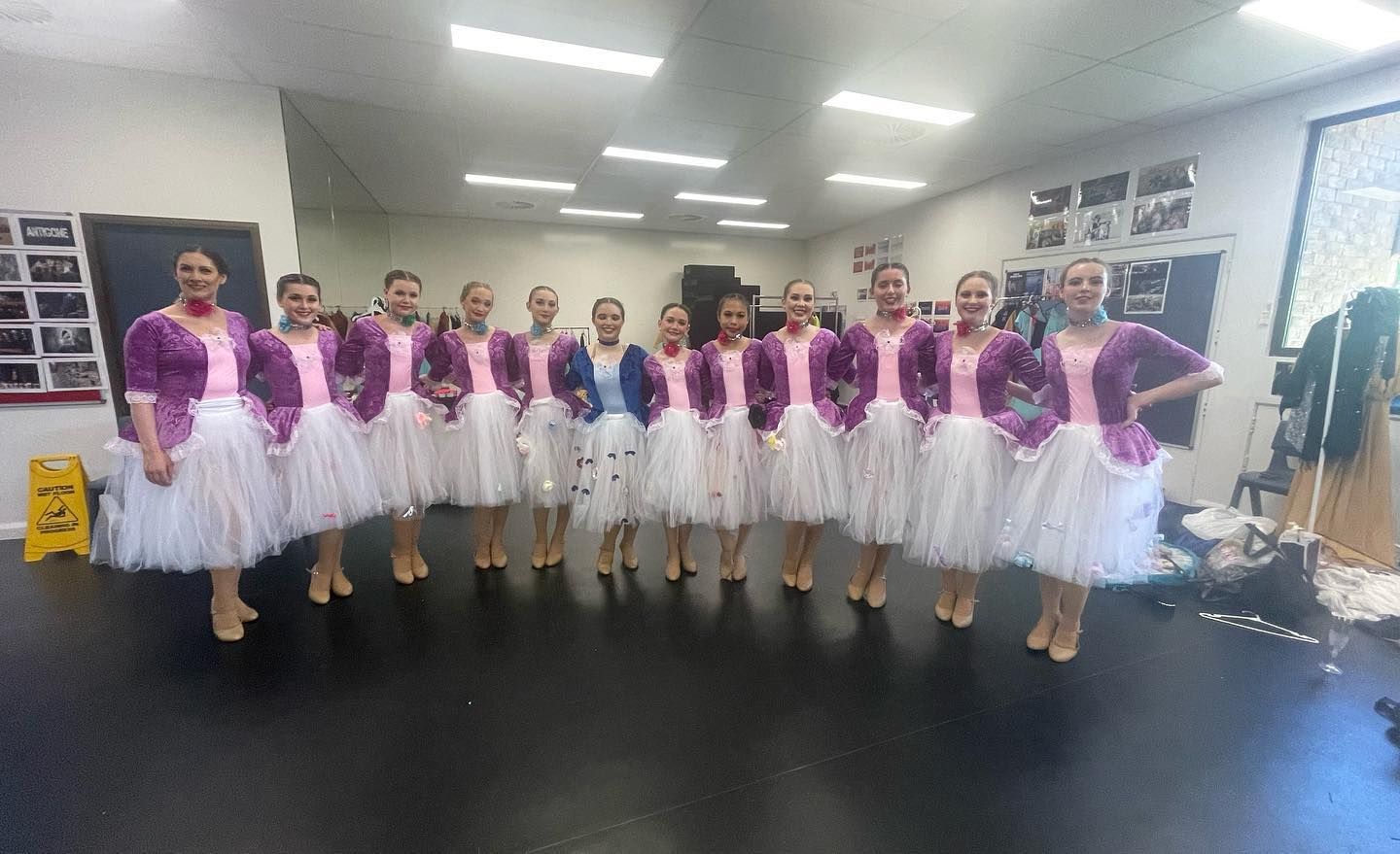 A Dance Troupe of Girls Wearing White Tutus and Pink and Purple Tops — Kay Flynn Dancing Academy Southport in Southport, QLD