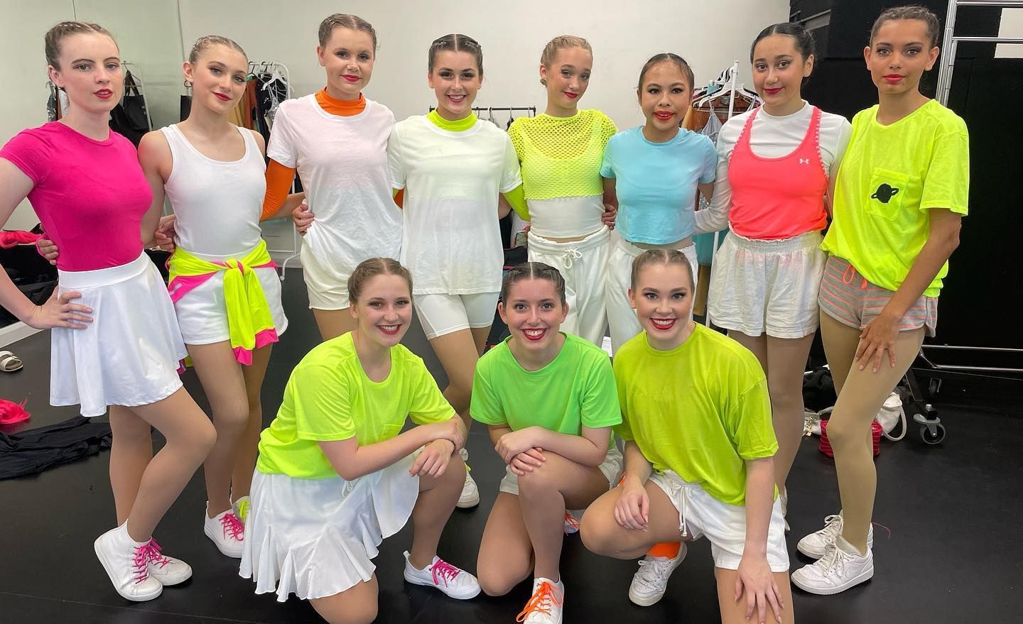 A Group of Young Women in Vibrant, Neon-coloured Dance Outfits — Kay Flynn Dancing Academy Southport in Southport, QLD