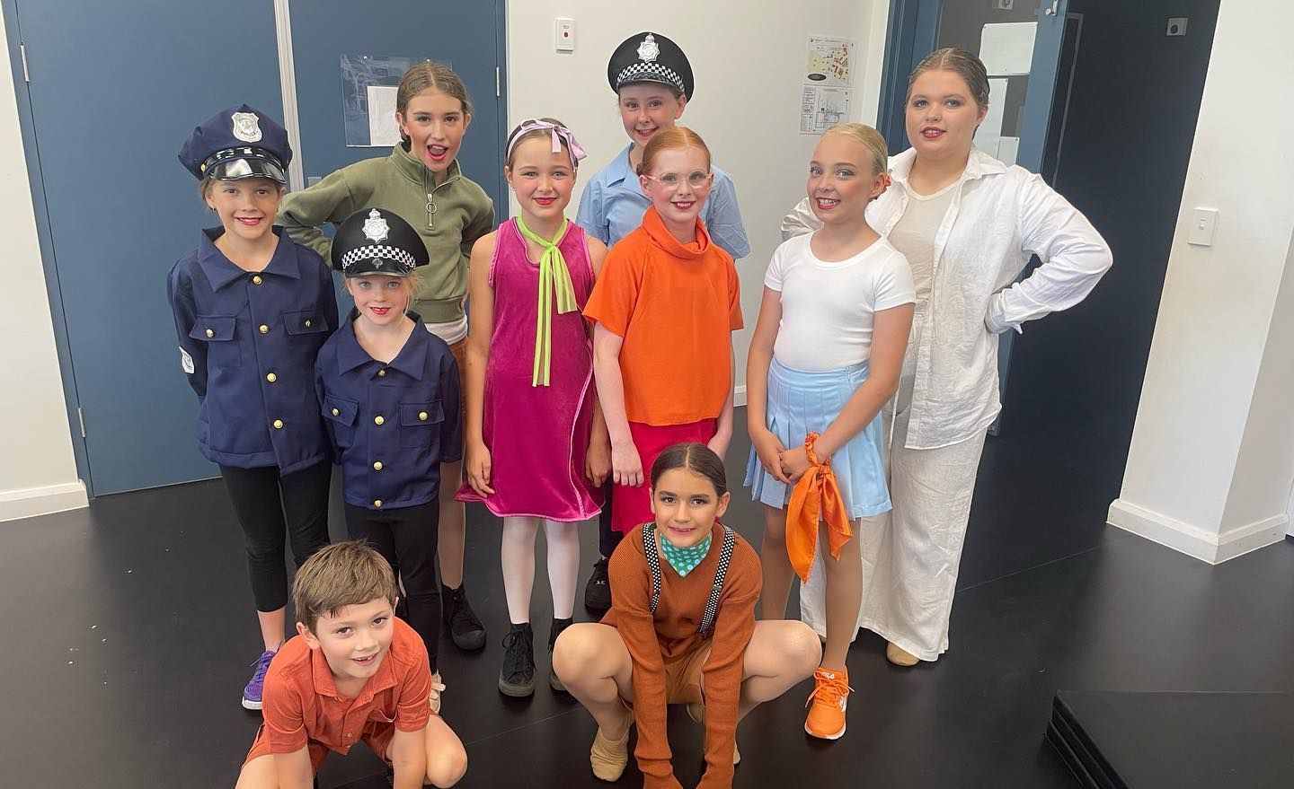 Group of Children in Costumes Posing Indoors — Kay Flynn Dancing Academy Southport in Southport, QLD