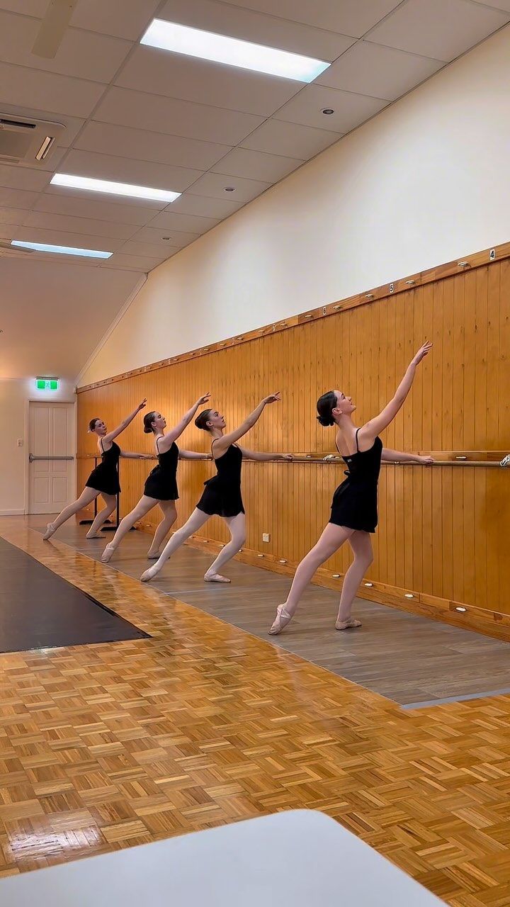 Four Ballet Dancers in Black Dresses Practicing at a Barre — Kay Flynn Dancing Academy Southport in Southport, QLD