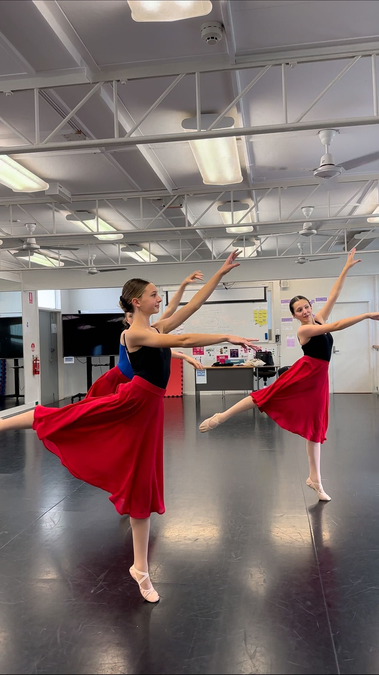 Two Ballet Dancers in Red Skirts and Black Tops — Kay Flynn Dancing Academy Southport in Southport, QLD