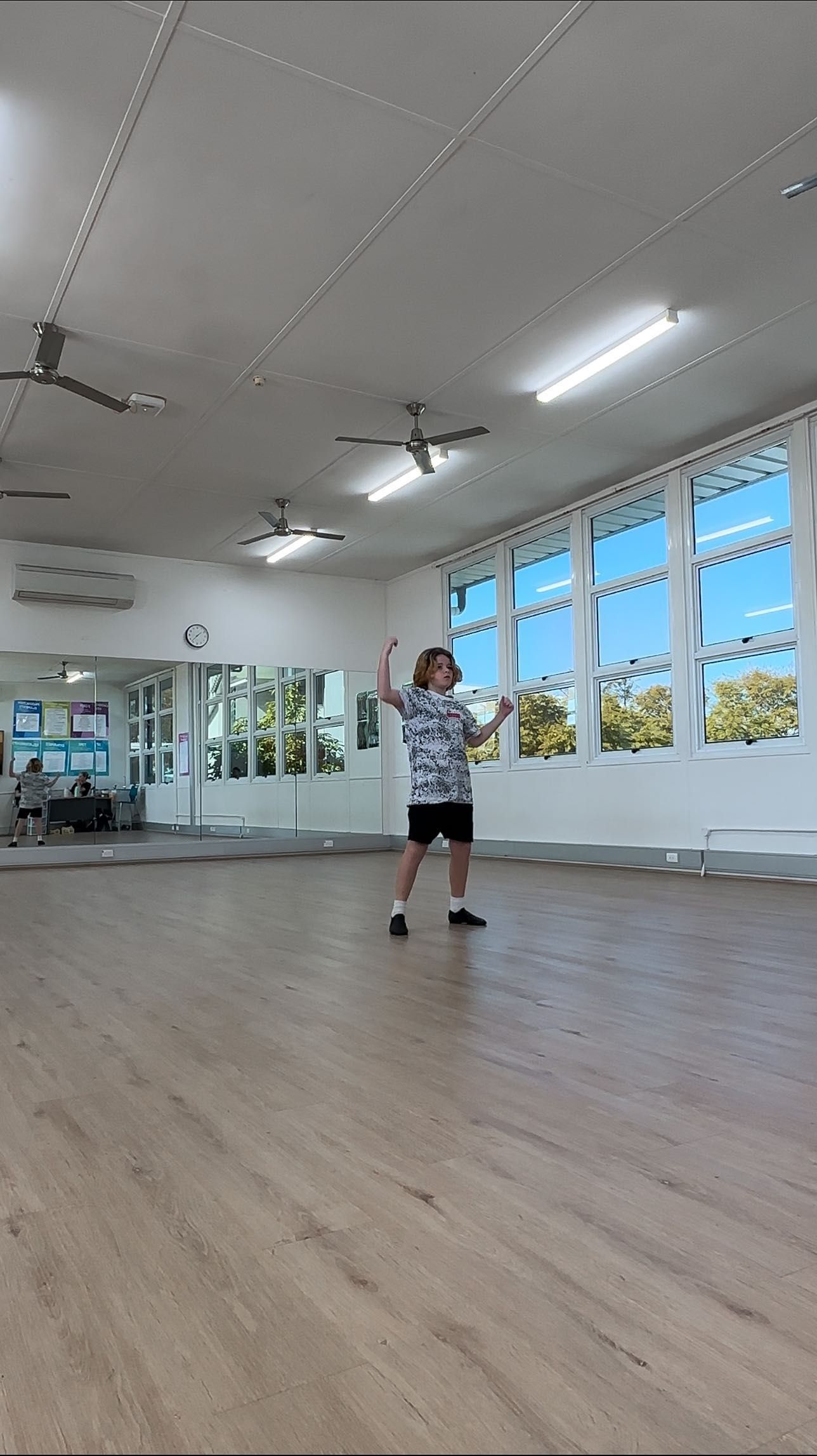 A Person in a Dance Studio With Arms Raised — Kay Flynn Dancing Academy Southport in Southport, QLD