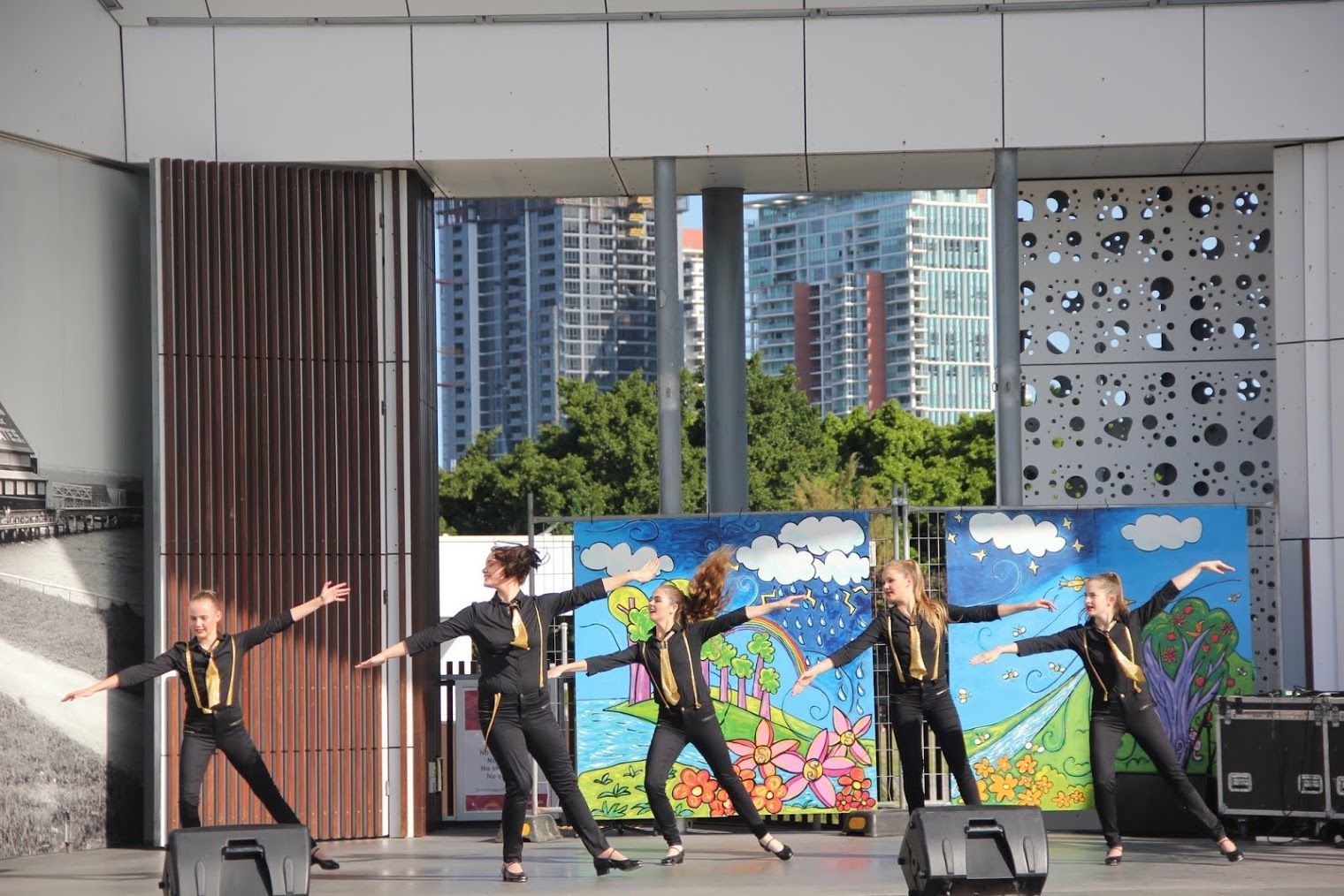 Dancers in Black and Gold Outfits Perform on Stage — Kay Flynn Dancing Academy Southport in Southport, QLD