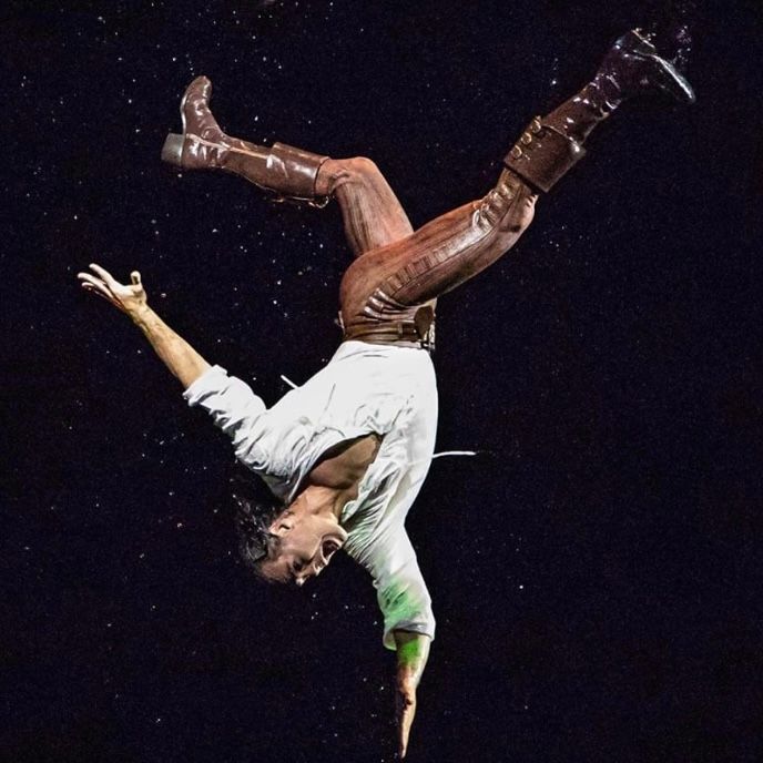 A Man in Brown Boots and Pants Performs an Acrobatic Handstand — Kay Flynn Dancing Academy Southport in Southport, QLD