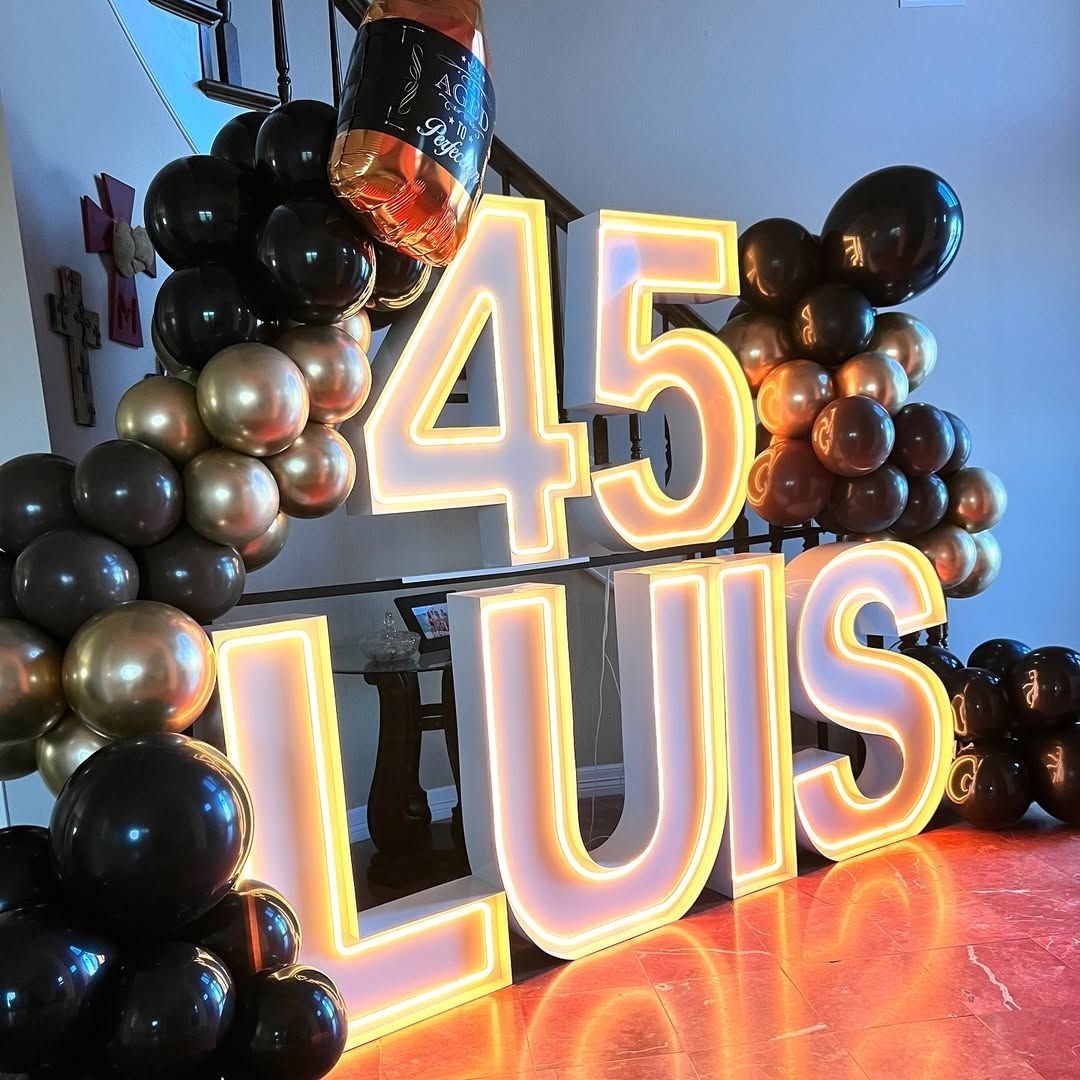 Girl in yellow jumpsuit celebrates a 