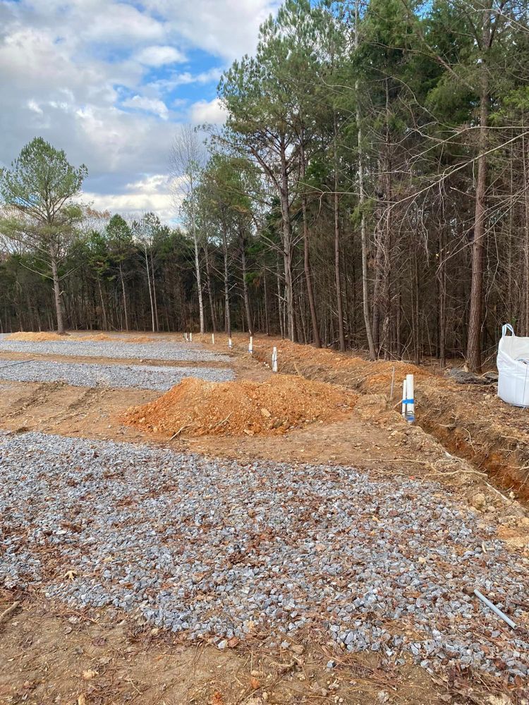 There is a lot of dirt and rocks in the middle of a forest.