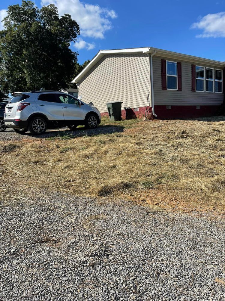 A white suv is parked in front of a mobile home.