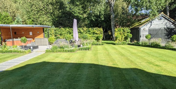 Sunny garden with shed and summer house