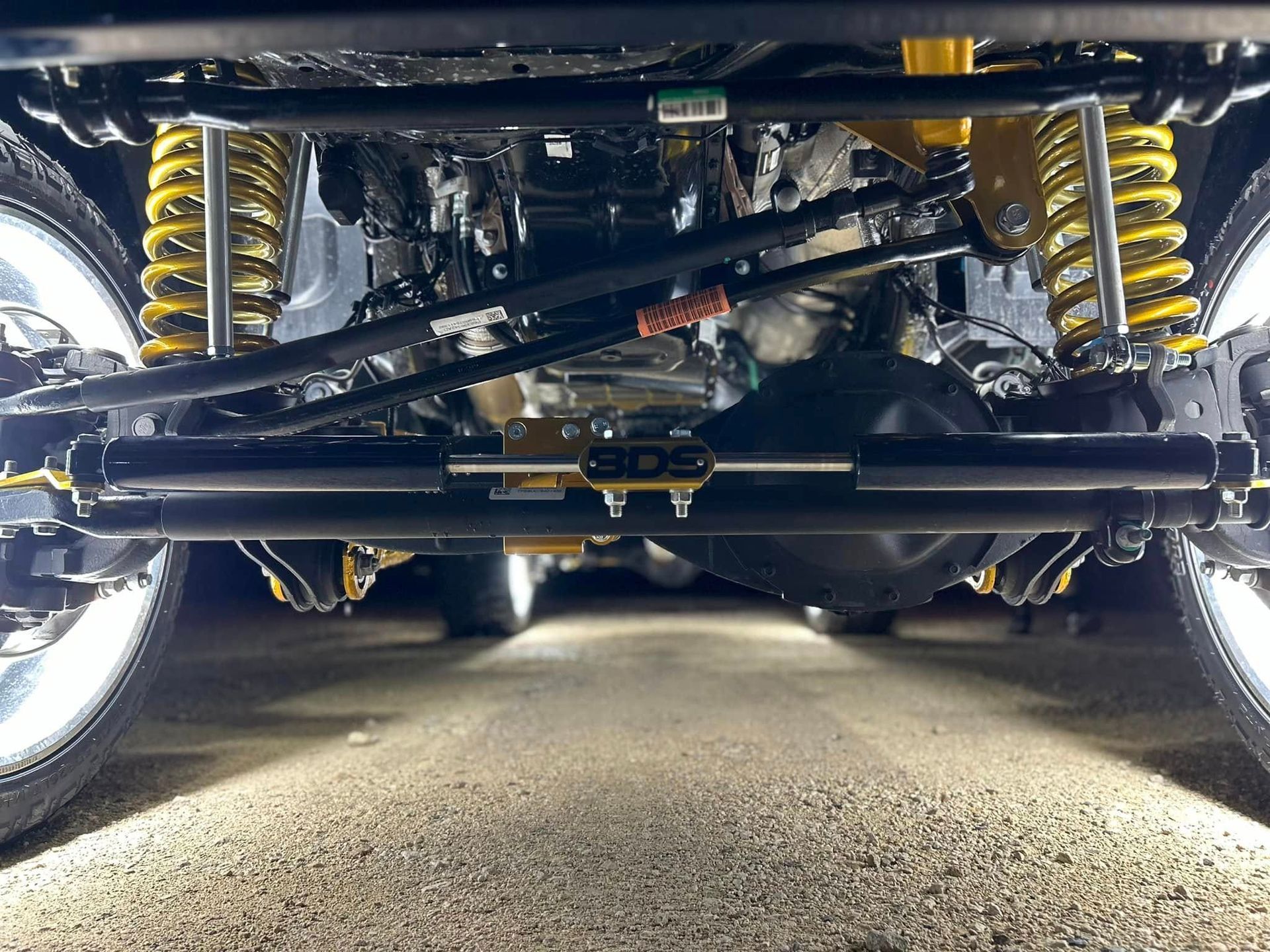 A close up of the underside of a car 's suspension system