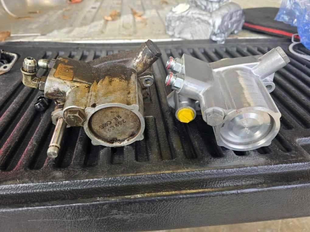 Two pieces of metal are sitting on top of a truck bed.