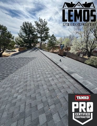 A roof with a pro certified contractor logo on it.