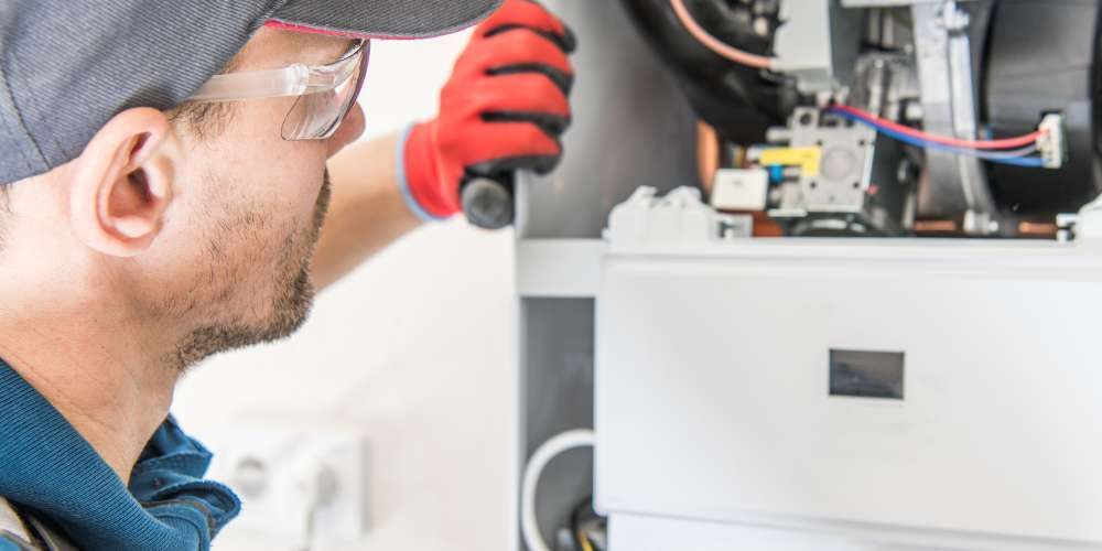 Technician inspecting a furnace