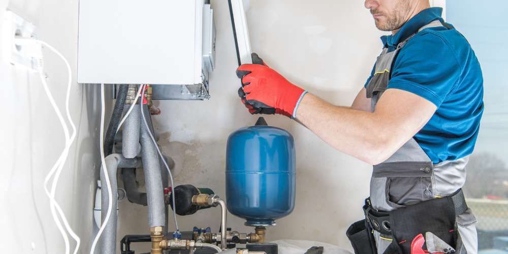 HVAC technician inspecting home furnace