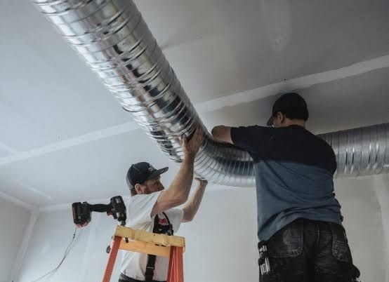 Water heater repair LA in Mirada, CA technician inspecting faulty unit