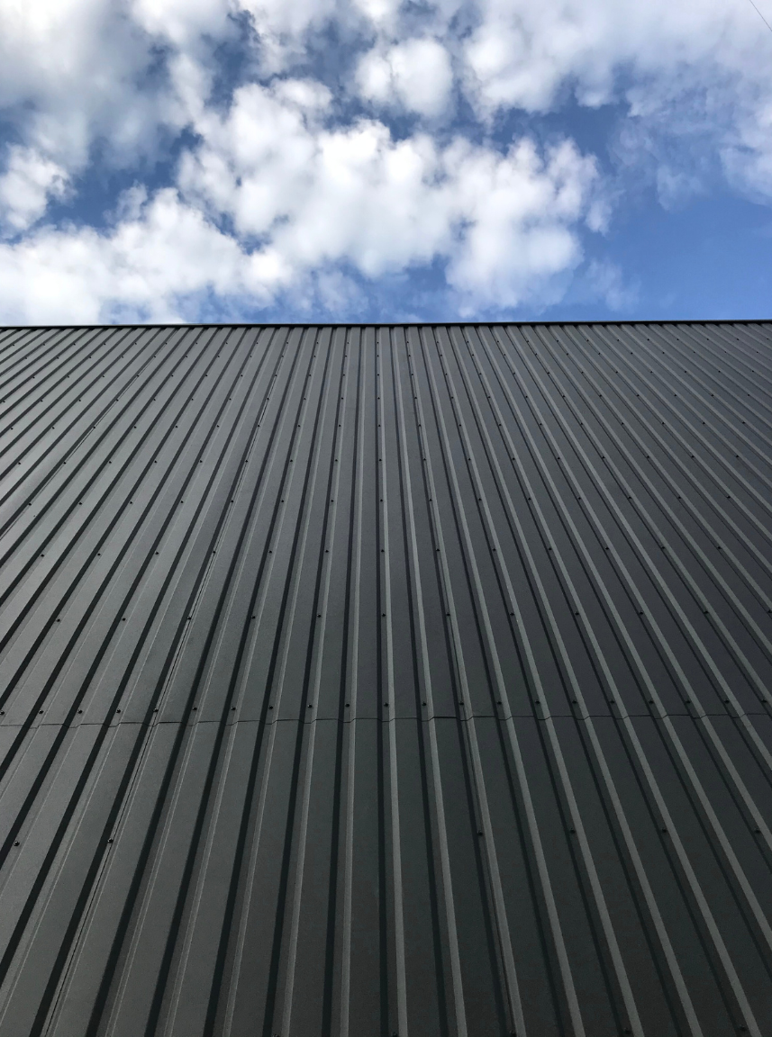 black metal roof and blue sky