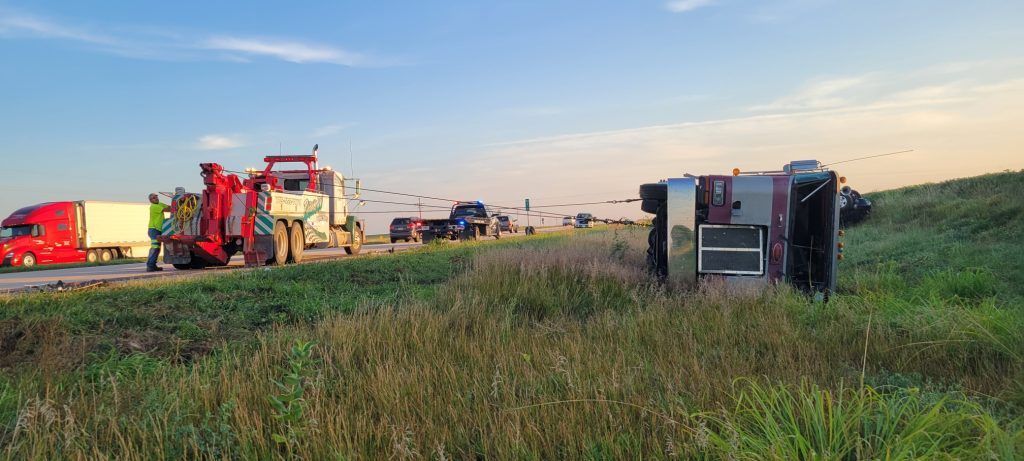 A truck has turned over on the side of the road.