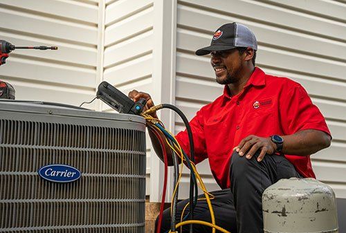 HVAC tech performing AC repair in Evans, GA