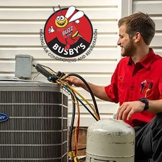 Busby's HVAC tech repairing a home AC