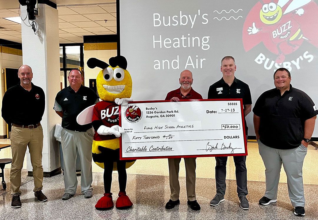 Busby's Donation Check to Evans High School Athletics