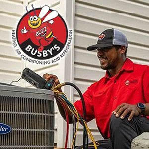 Busby's tech repairing an HVAC system at a home in Jackson, SC