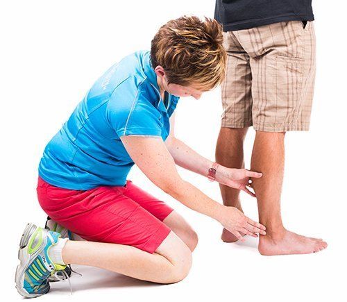 Podiatrist treating the injured foot