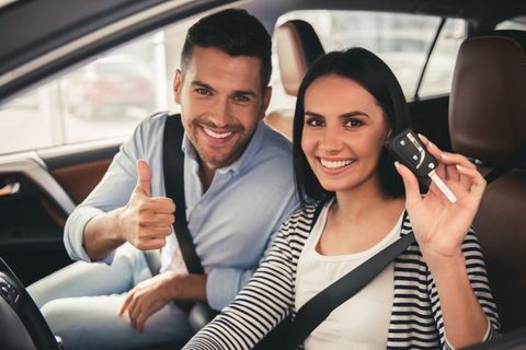 Personal Insurance — Couple Inside Their New Car in Peoria, IL