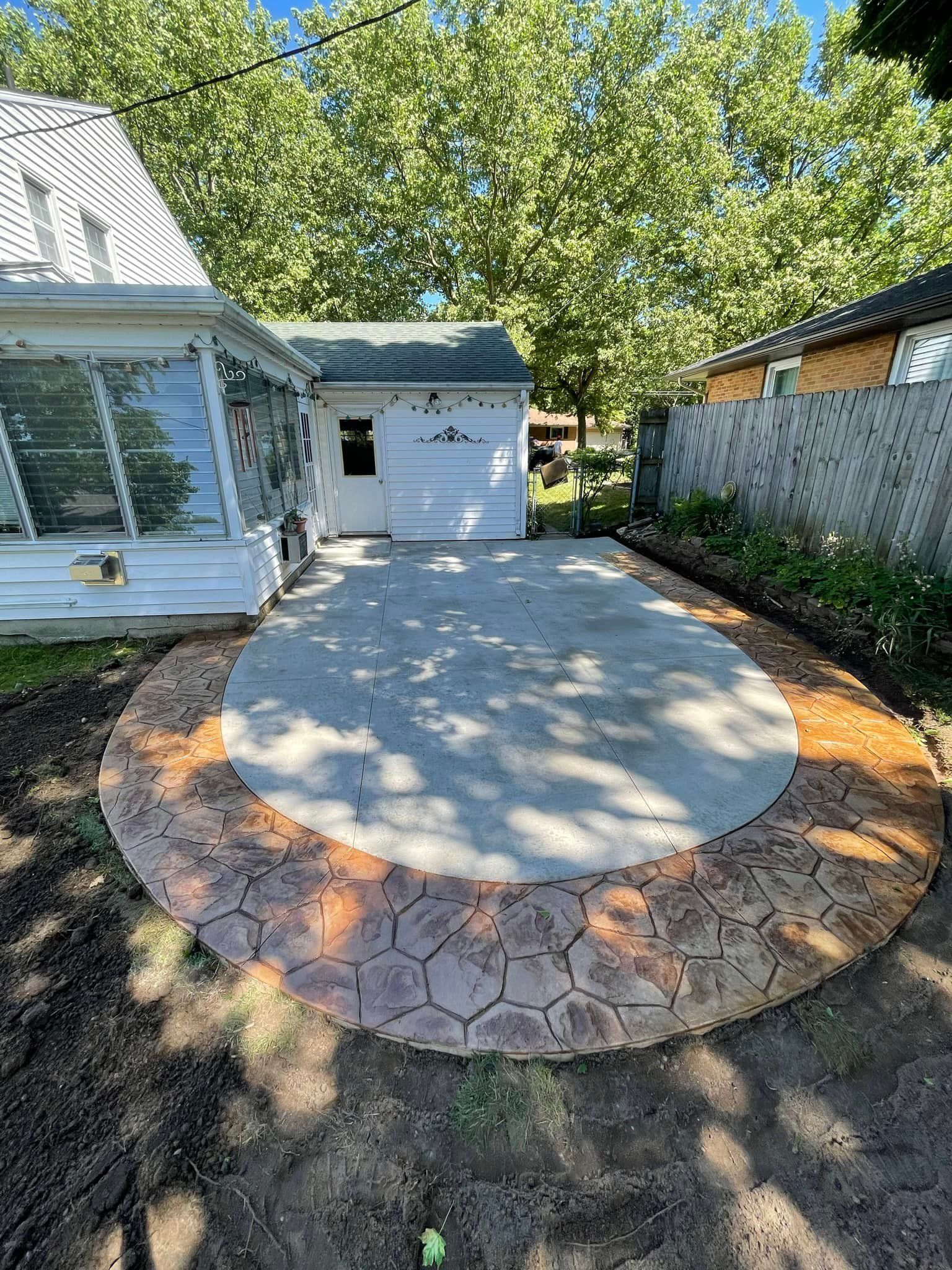 A circular driveway is being built in front of a house.
