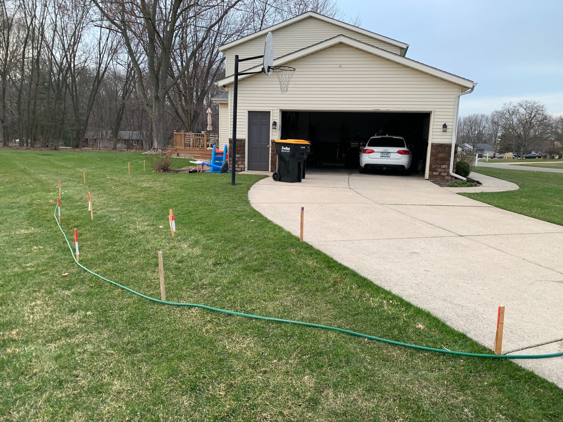 A car is parked in the garage of a house.