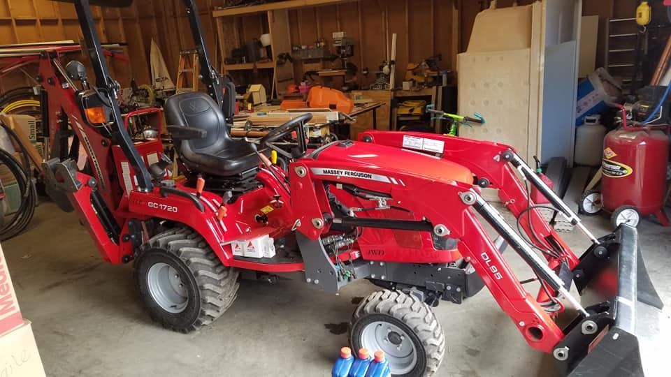 Red tractor with a backhoe | Tenino, WA | M & L Equipment
