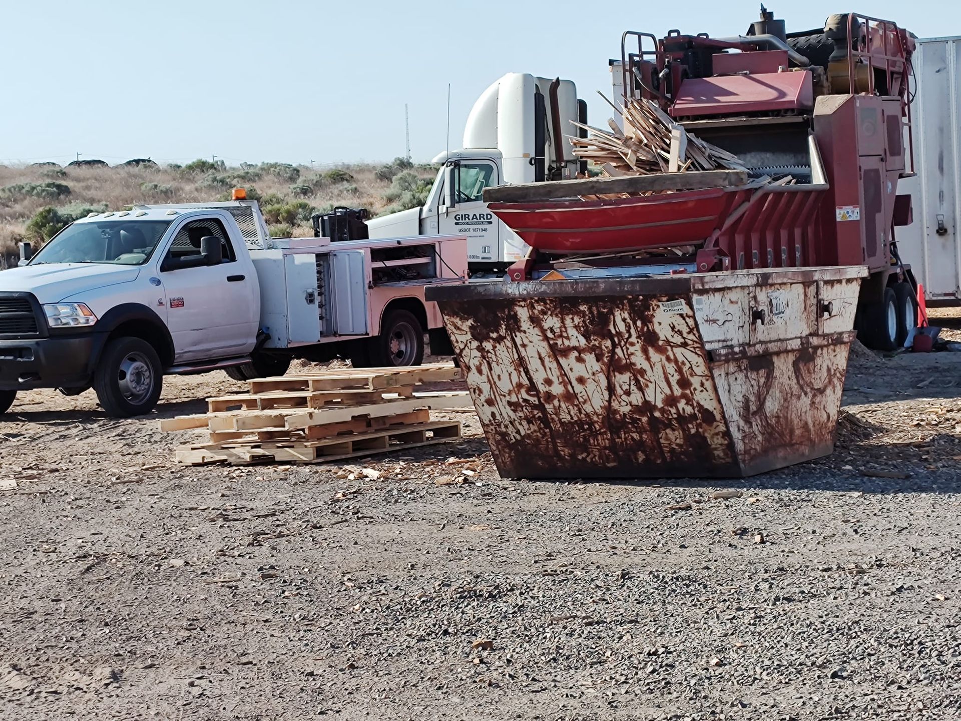 White truck beside the large dumpster | Tenino, WA | M & L Equipment