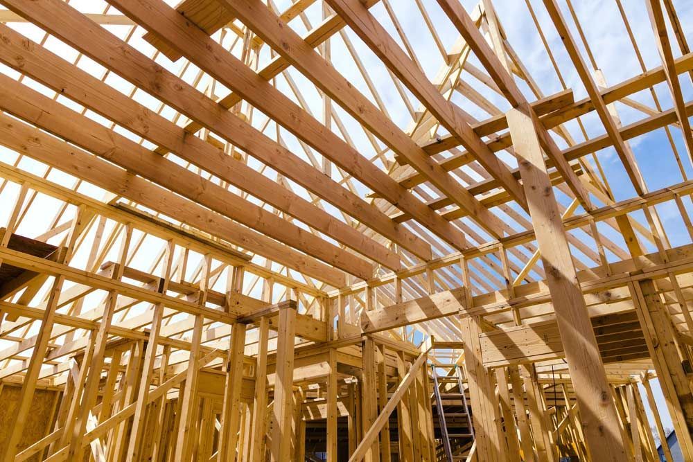 Wooden Framework of a Building Under Construction With Beams and Studs — CJ Custom Carpentry in Thrumster, NSW