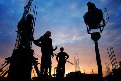 Silhouettes of workers at a construction site - Workers' compensation in Glen Burnie, MD