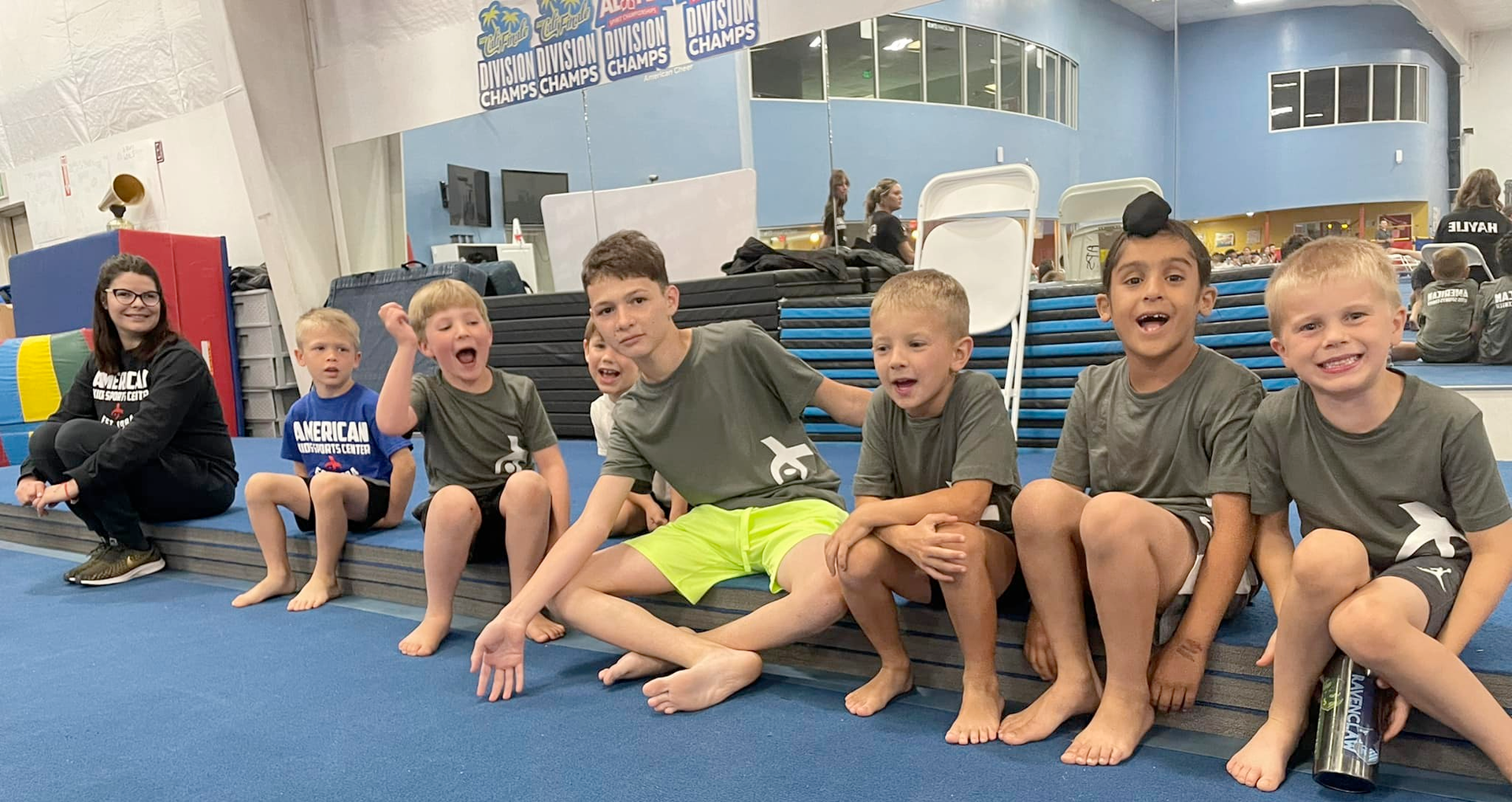 A group of cheerleaders are performing in front of an orange star