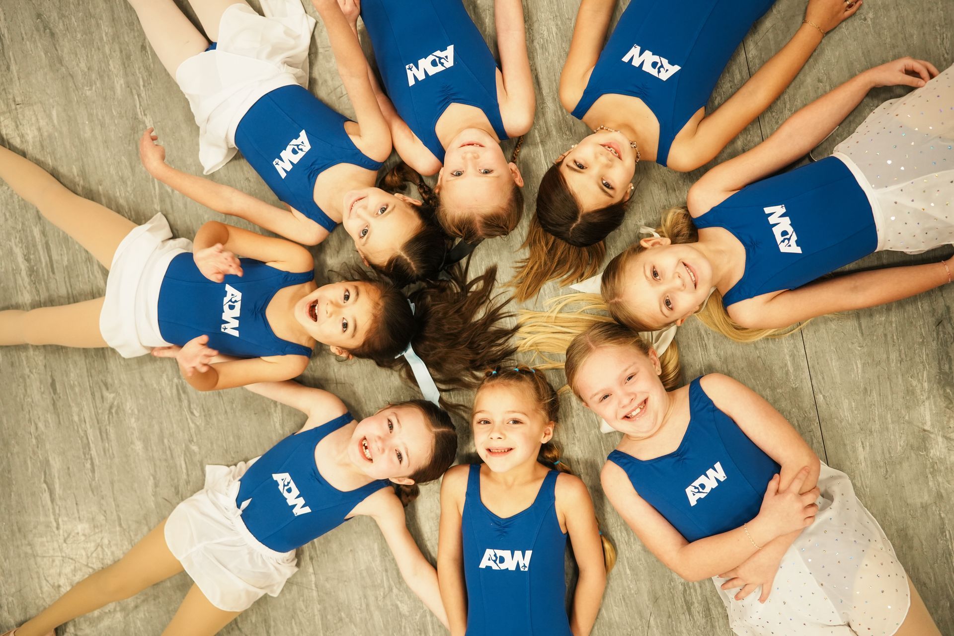 A group of people dressed in costumes are posing for a picture.