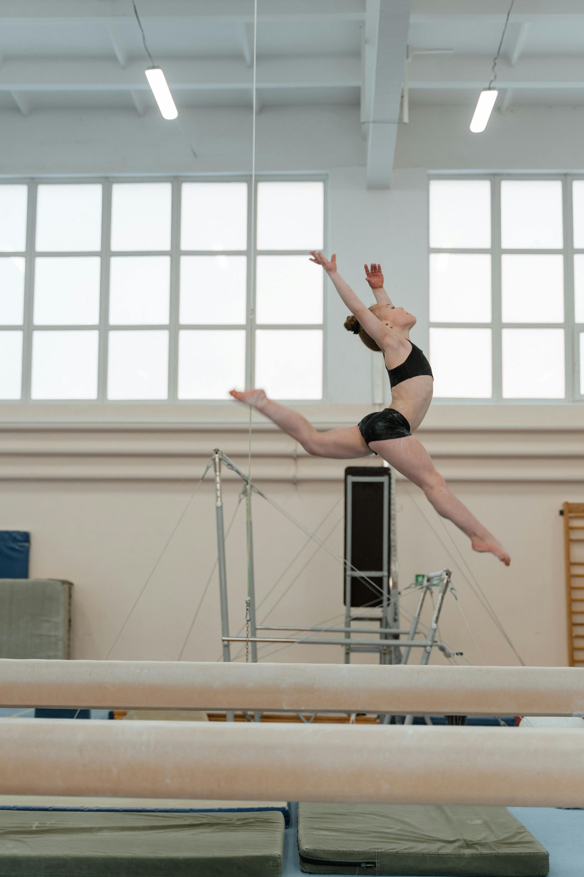 Girl performing gymnastics touching her toes