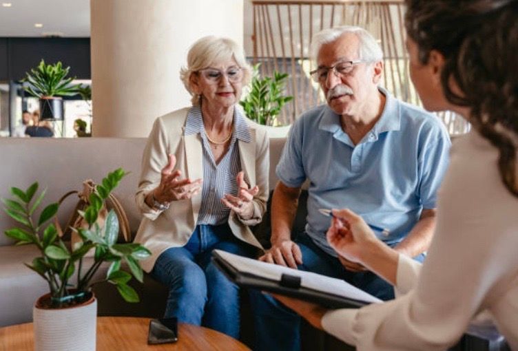 older couple talking with realtor