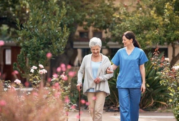 lady and nurse walking