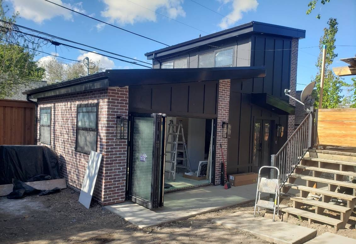 An empty kitchen with a large island in the middle