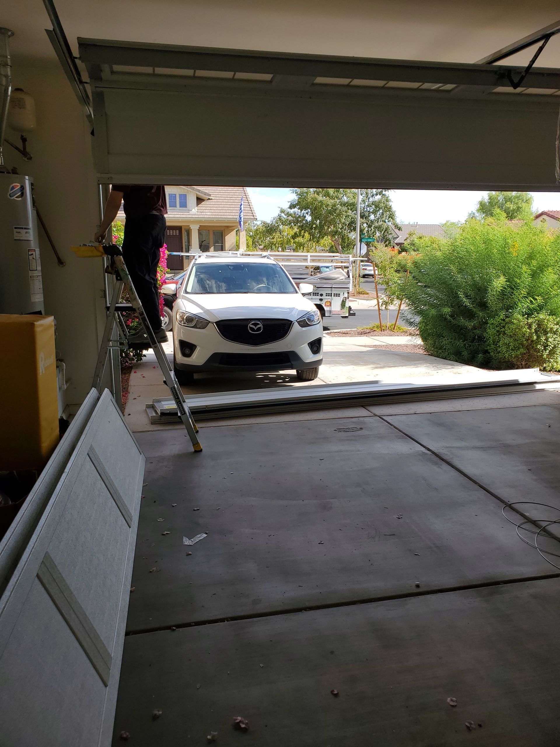 tech working on new garage door installation