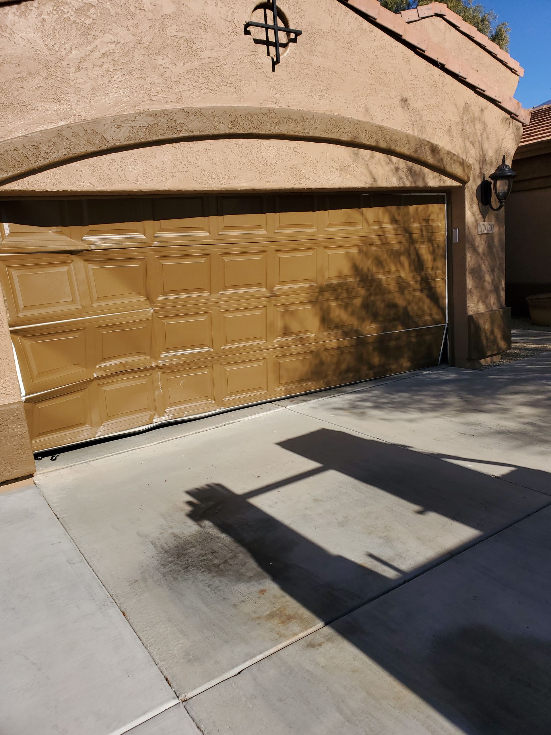 A crashed garage door that needs to be replaced