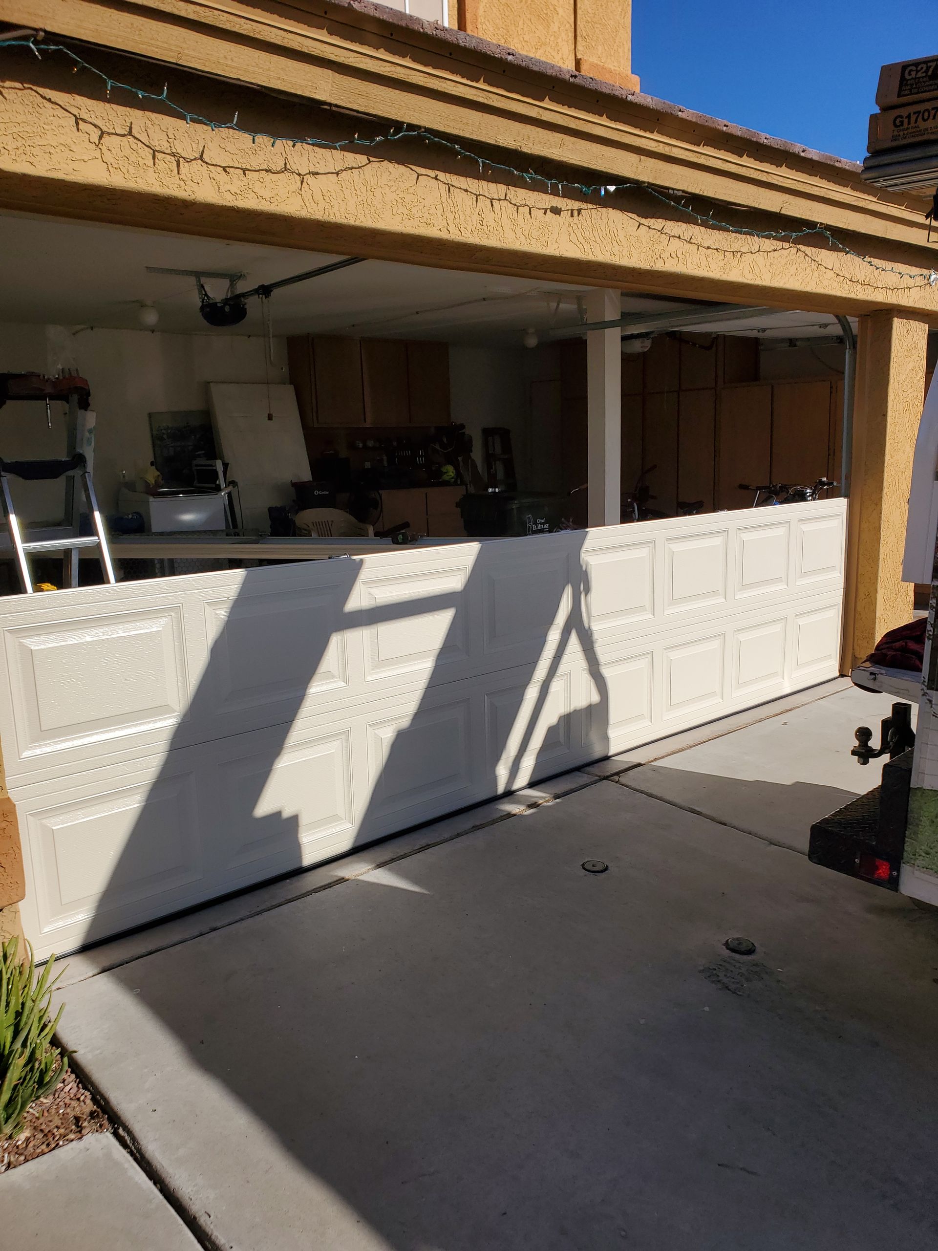 new garage door panels being replaced
